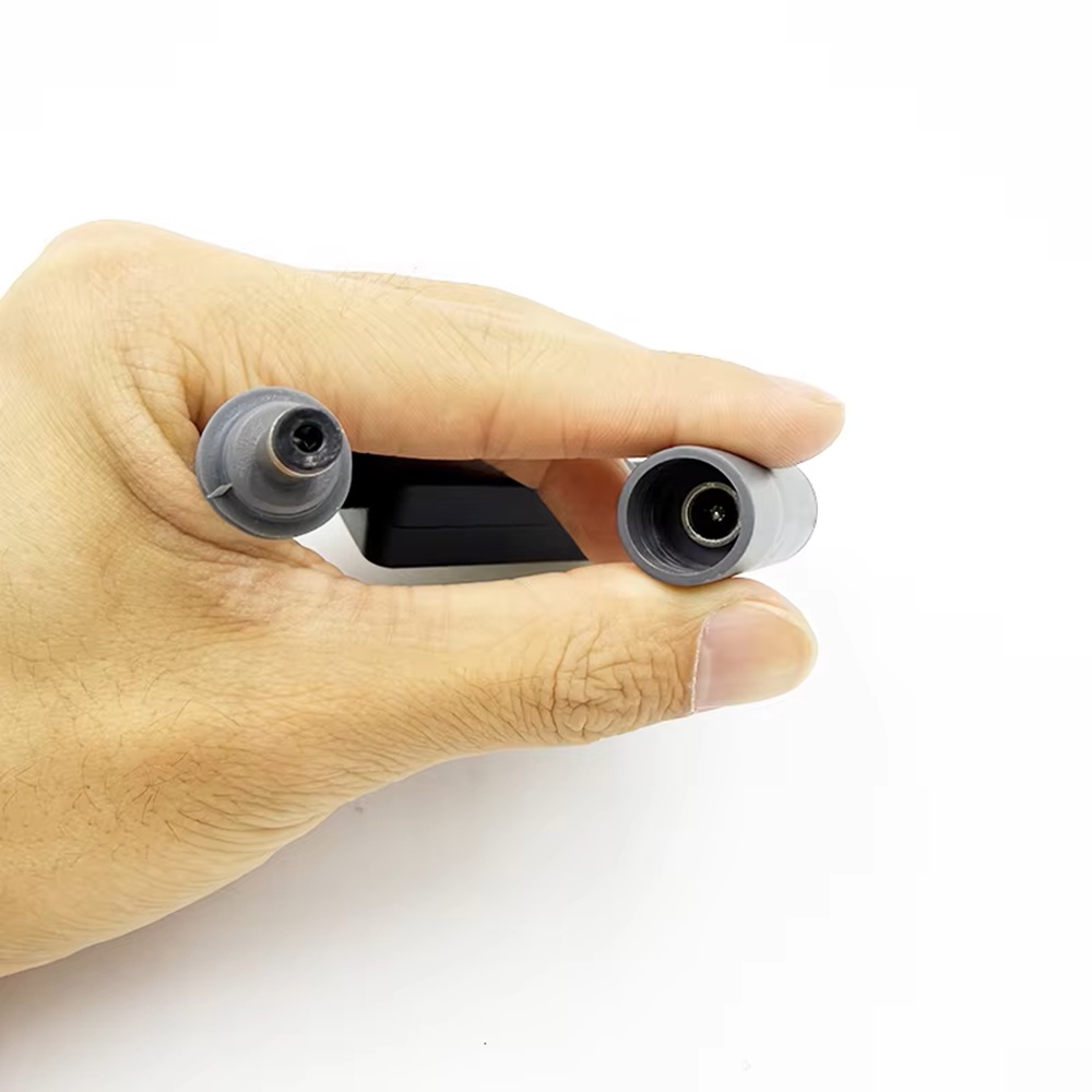 Close-up of DC male and female connectors on Air Vision Systems Starlink remote power switch power supply end